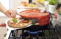 This pizza oven sits on top of your stove…Cooks a Pizza in 6 Minutes